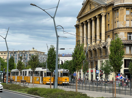 Budapest, Hungary - 13.07.2022: Yellow tram stands in front of Anker house. Budapest, Hungaryのeditorial素材