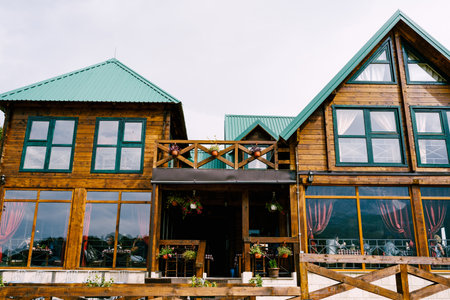 Zabljak, Montenegro - 01.05.21: Wooden hotel with a glazed terrace in the north of Montenegroのeditorial素材