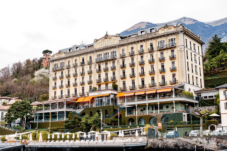 Como, Italy - 07.04.18: Grand hotel in Tremezzo, surrounded by mountains and greenery. Lake Como, Italyのeditorial素材