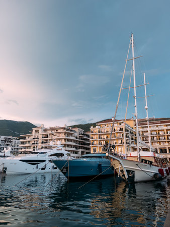 Yachts stand near the shore with expensive terraced villas. Porto, Montenegroの写真素材