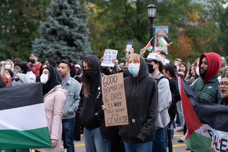 Toronto, Canada - 18 October 2023: Heartfelt signs and unwavering voices merge, highlighting...