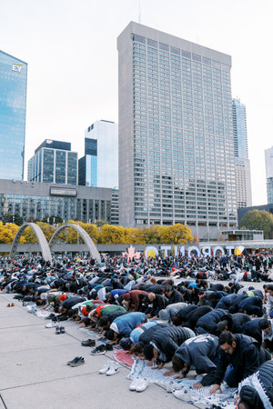 Toronto, Canada - 28 October 2023: Muslim prayer from Palestine in the city square of Toronto. They...