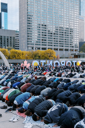 Toronto, Canada - 28 October 2023: Muslim prayer from Palestine in the city square of Toronto. They...