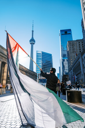 Toronto, Canada - 28 October 2023: Anti-war march in Toronto by Palestinians against Israels...
