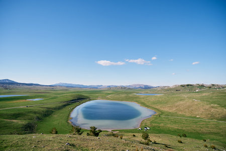 Blue Devil Lake in a green valley in Durmitor National Park. Montenegro