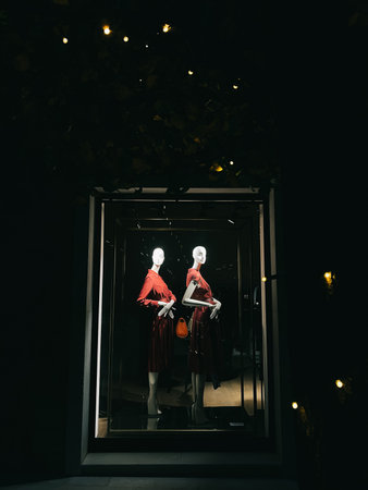 Tivat, Montenegro - 25 december 2022: Darkened shop window with classic women clothing