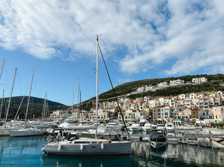Lustica, Montenegro - 01 november 2023: Lustica bay marina with moored yachts and colorful houses at the foot of the mountains. Montenegroのeditorial素材