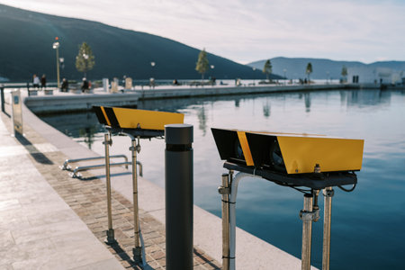 Observation deck on the shore with fixed observation binocularsの写真素材