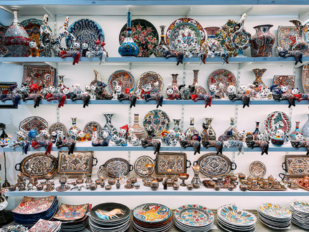 Kotor, Montenegro - 25 december 2022: Ceramic multi-colored figurines, dishes and vases are on the shelves in the storeのeditorial素材