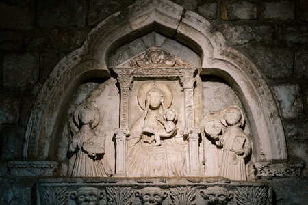 Bas-relief on the old stone sea gate depicting the Virgin Mary with the baby. Kotor, Montenegroの写真素材