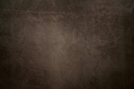 Dark concrete background with cracks and scratchesの写真素材