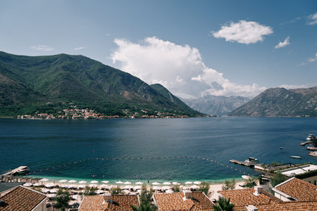 Private sandy beach with sun loungers on the seafront in front of the hotels. Huma Kotor Bay Hotel...