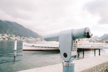 Paid monocular telescope on the shore. Lake Como, Italyの写真素材