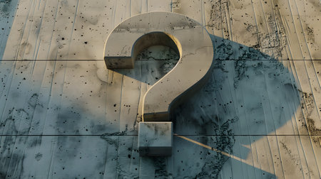 Concrete wall with a shadow in the shape of a question markの素材