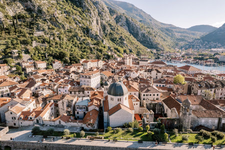 Church of St. Nicholas among old houses with red roofs. Kotor, Montenegro. Droneの写真素材