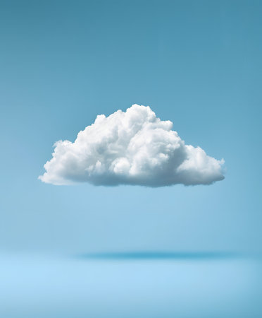 A serene white cloud peacefully floating in a calm blue skyの素材