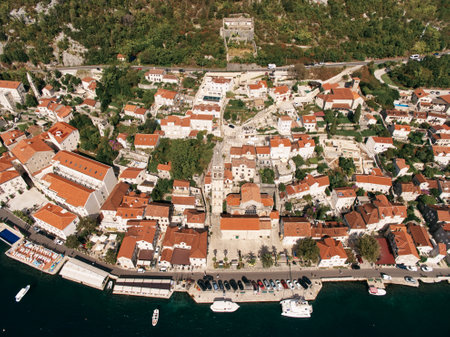 Parking on the promenade in front of the Church of St. Nicholas. Perast, Montenegro. Top view. High...