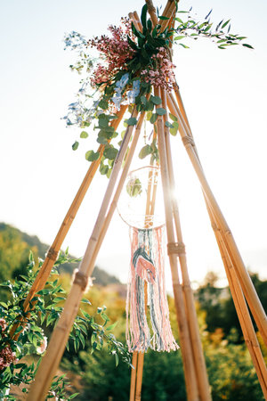 Sun shines through the top of a tipi arch. High quality photoの写真素材