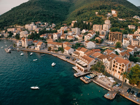 Promenade with old houses and moored boats. Tivat, Montenegro. Droneの写真素材