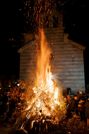 Budva, Montenegro - 06 january 2024: Christmas Eve Bonfire Celebration in Old Town Budva, Montenegro