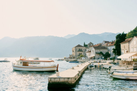 Fishing boats are moored in a row off the coast of Perast. Montenegroの写真素材