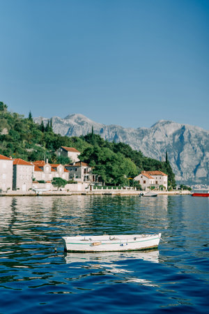 Fishing boat is moored in the sea near the coast of Perast. Montenegroの写真素材