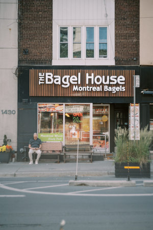 Toronto, Canada - June 25, 2025: Montreal Bagel Shop Exterior With Customers