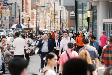 Toronto, Canada - May 26, 2026: Busy Downtown Street Scene with Pedestrians and Street Vendors