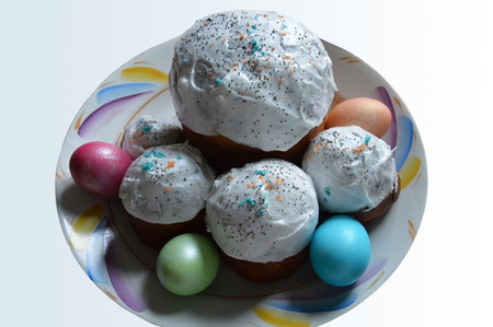 Easter cakes and painted eggs on the colored dish. The view from the top.