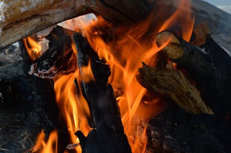 A fire kindled on the snow on a cold day
