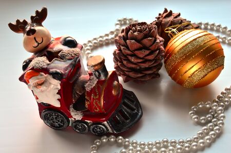 Christmas composition. Toy train carries Santa Claus on the occasion.の写真素材