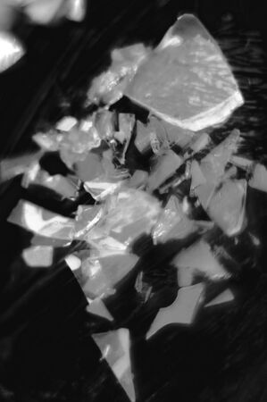 Abstraction. Broken glass. Variety of forms. Photo black and white. Vertical photo.の写真素材