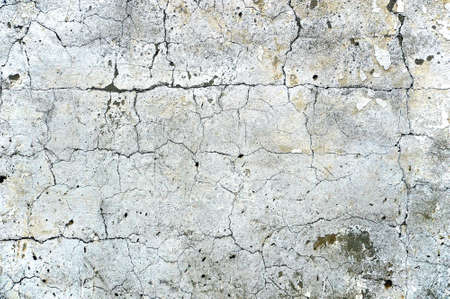 White cement wall background with cracks. Drawing for interior and space decoration. The wall is...