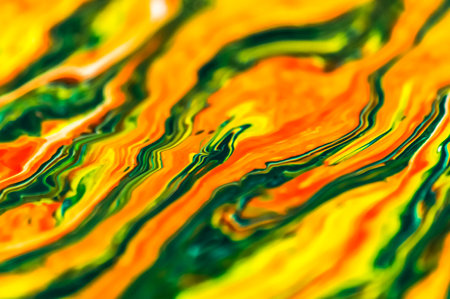 abstract background of oil paint in yellow, orange and green colors