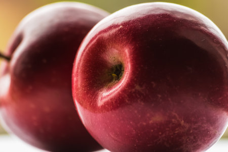 Red apples on a white background, shallow depth of field, macro