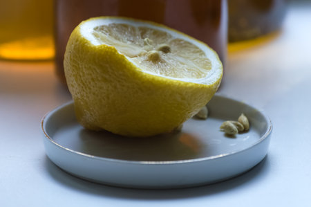 Lemon and honey on a white background. Selective focus.