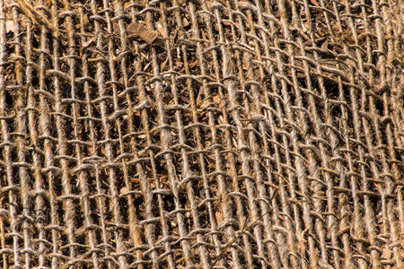A background texture of burlap cloth rough jute meshの写真素材