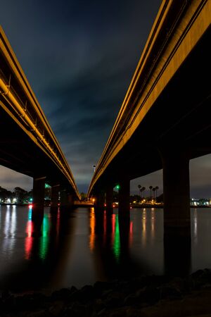Night cityscape double bridge and cross lights