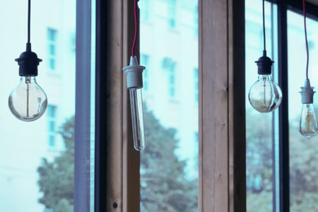 Light bulb in the window, vintage tone, good idea concept.の写真素材