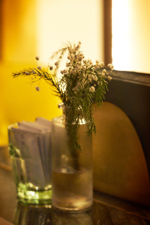 Bouquet of dried flowers in a glass vase on the tableの写真素材