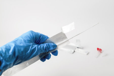 Man makes a antigen pcr test macro. The test showed a positive result.