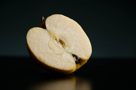 Half of apple on a black backgroundの写真素材