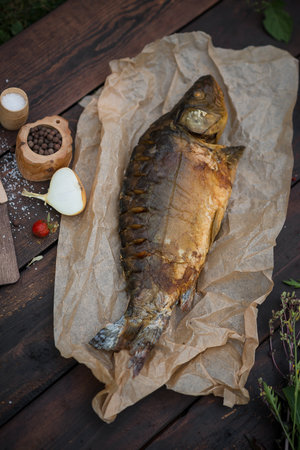 Mirror carp hot smoked on craft paper