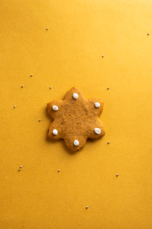 Christmas gingerbread with icing on a gold background. Christmas pastries.の写真素材
