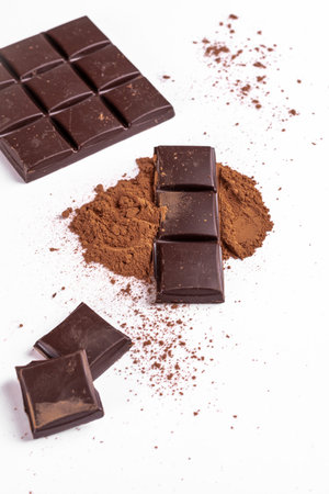 Cocoa hit on a white background, a bar of chocolateの写真素材