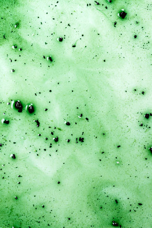 Chlorophyll texture is a green liquid with small and large dark particles.の写真素材
