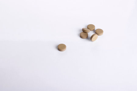 Pills isolated on white background, khaki colorsの写真素材