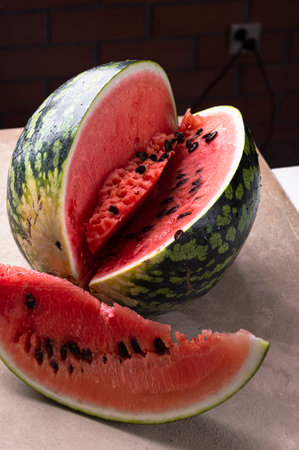 Cut watermelon on gray and beige backgroundの写真素材