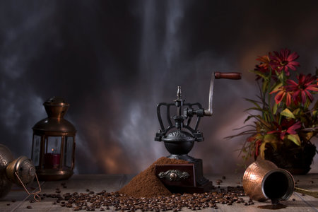 Coffee grinder still life against the backdrop of the fireplace, candle copper, coffee makerの写真素材