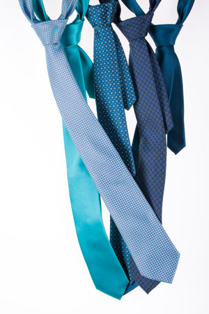 Five silk ties turquoise color on a white backgroundの写真素材